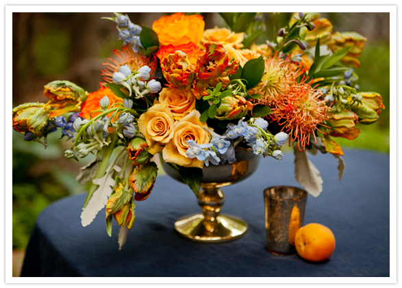vibrant orange and peach floral centerpiece