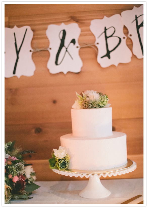 simple white cake and floral accent simple white cake and floral accent