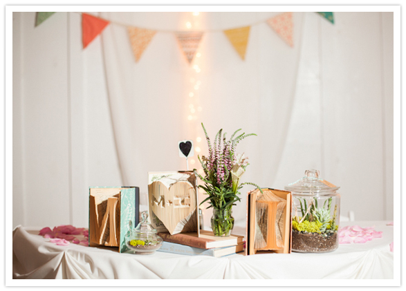 cut-out book art and terrarium centerpieces