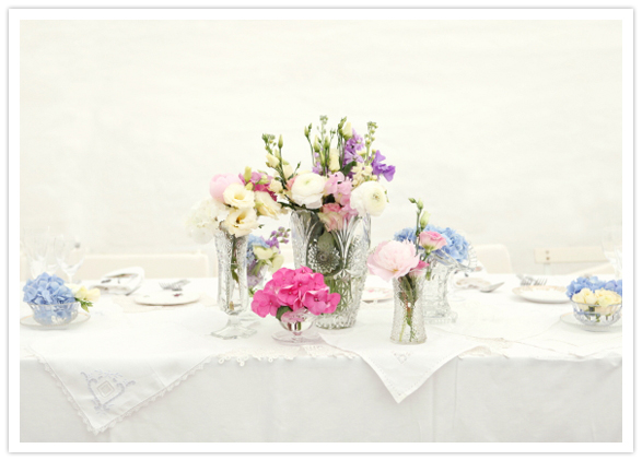 crisp white linens and pastel floral centerpieces crisp white linens and pastel floral centerpieces