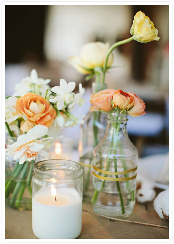 orange florals in painted stripe bottle vases orange florals in painted stripe bottle vases