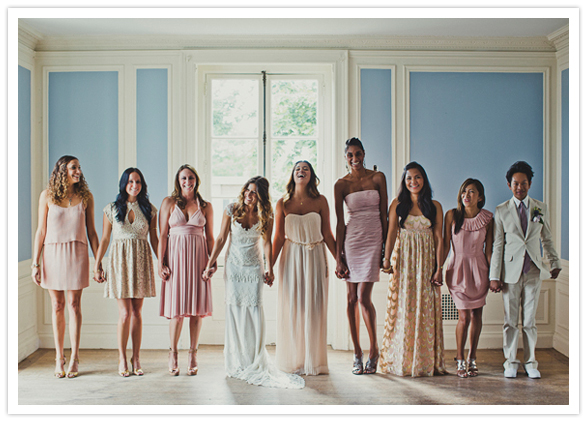 pastel shades of pink and peach bridesmaid dresses