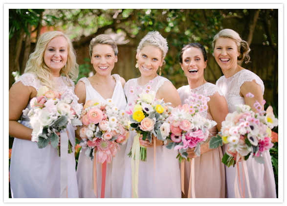 bridesmaids in hues of pink and peach bridesmaids in hues of pink and peach