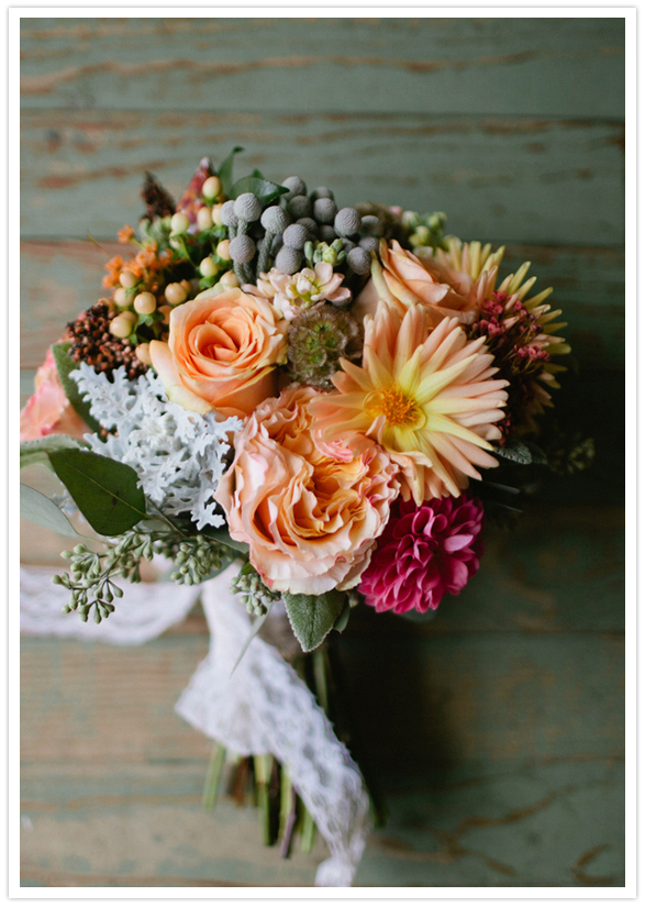 dusty miller, lamb's ear, variegated pittosporum, camellia, seeded eucalyptus, coral hypericum berries, silver brunia berries, globe scabiosa, ruffled garden roses, blush pink ranunculus, milva roses, soft peach tea roses, orange wax flower, and a yellow spiky dahlia bouquet