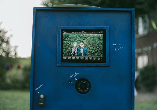 photo booth in front of ivy bush