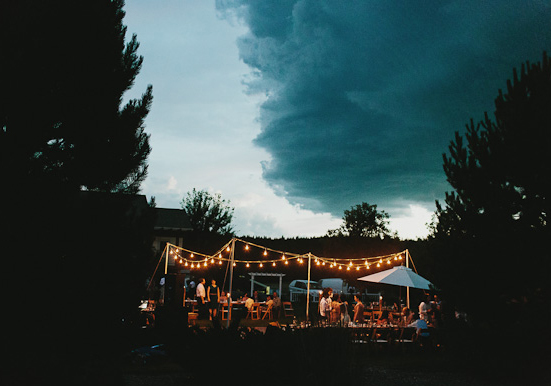 twinkle light garland and outdoor evening reception