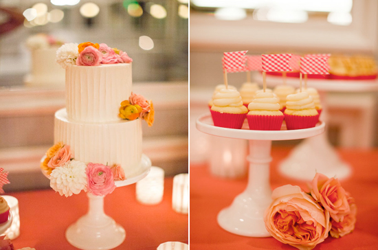 two-tiered white cake adorned with pink and gold flowers and checkered flag cupcake toppers two-tiered white cake adorned with pink and gold flowers and checkered flag cupcake toppers