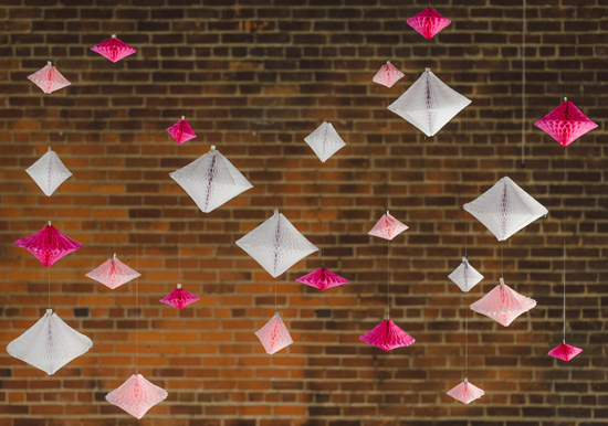 hanging pink and white paper geometric garlands