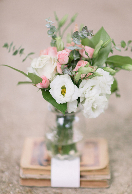 stacked books and pink and white floral arrangement stacked books and pink and white floral arrangement
