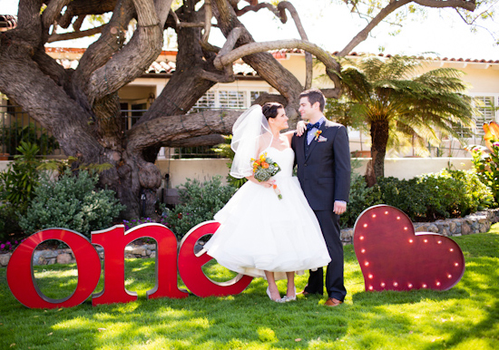 metallic "one (heart)" sign and Designer: Rosa Clara's Erudito wedding dress metallic "one (heart)" sign and Designer: Rosa Clara's Erudito wedding dress