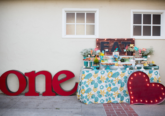 festive floral table linens and metallic "one (heart)" sign festive floral table linens and metallic "one (heart)" sign