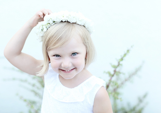white flower girl dress and floral crown  | Photo by Kimberly Genevieve