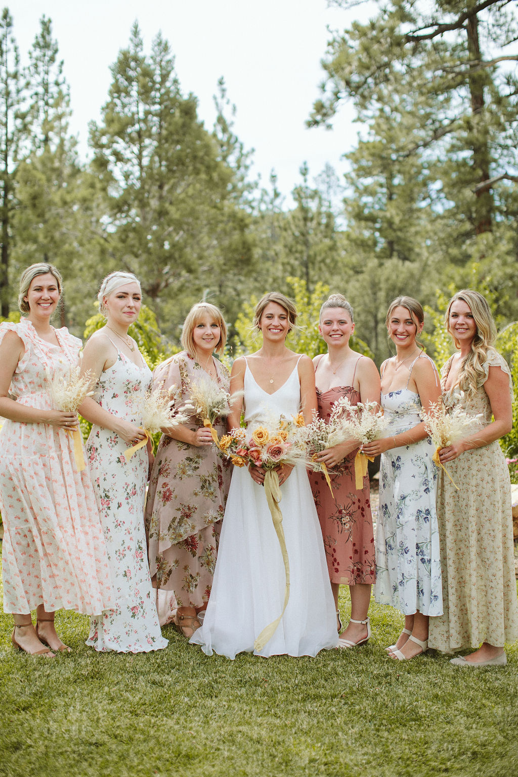 Steph + Austin Hendrix wedding by Paige Jones - floral bridesmaid dresses