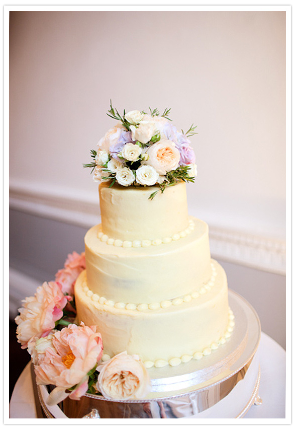 Classic White Wedding Cake with Pink, Peach, and Violet Flower Topper