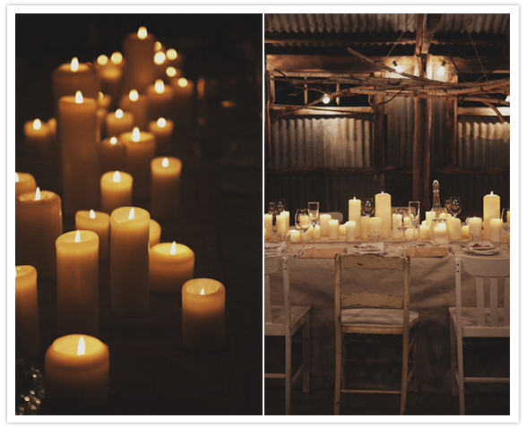 White pillar candles served as a simple centerpiece to the reception table. 