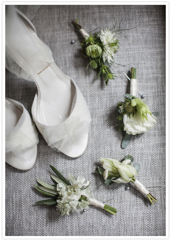 elegant white wedding shoes and simple boutonnieres