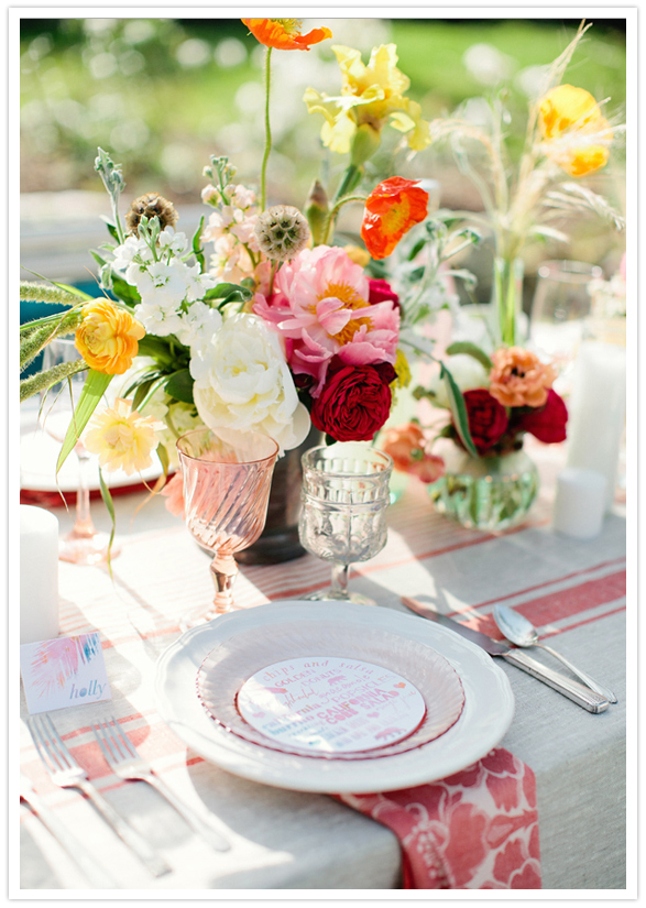 vibrant floral arrangements and dinnerware 