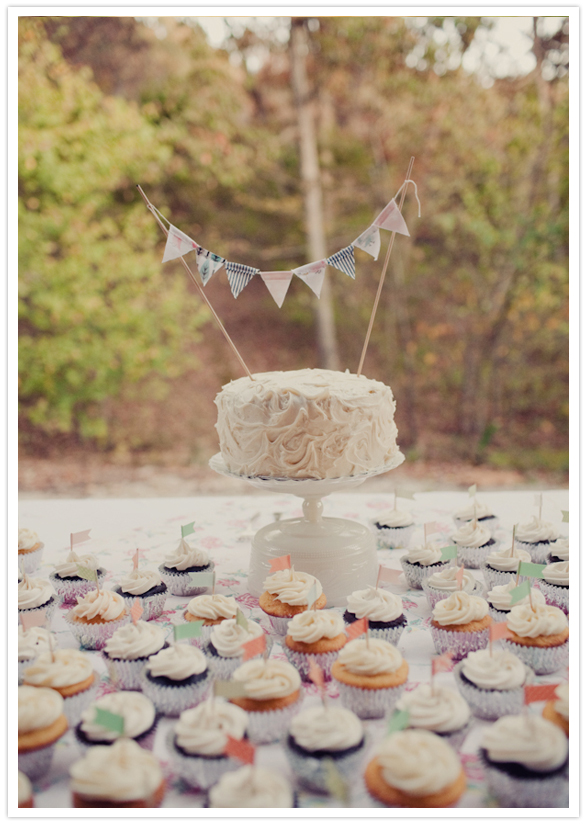 simple white wedding cake and cupcakes