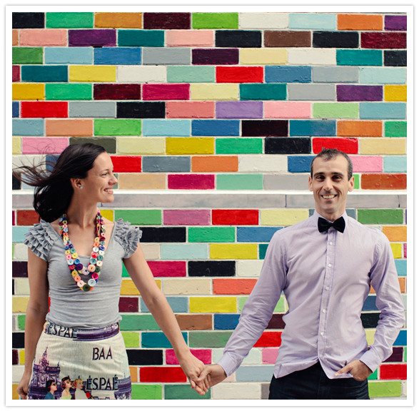 colorful brick wall engagement shoot