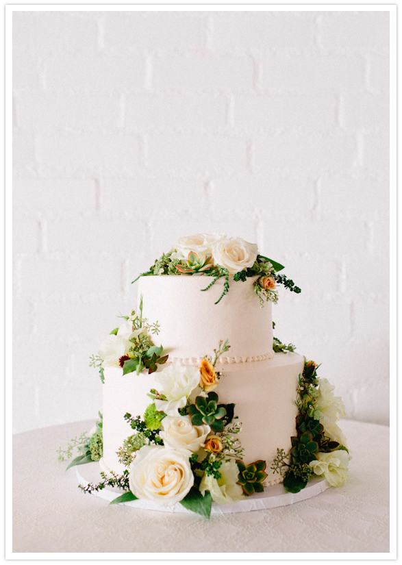 floral adorned white wedding cake