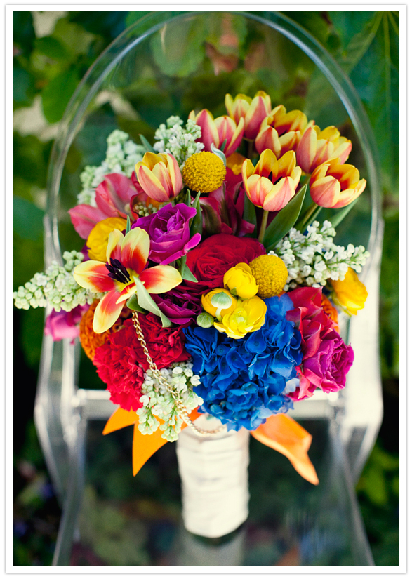 vibrant bouquet of yellow, orange, blue, pink, and red