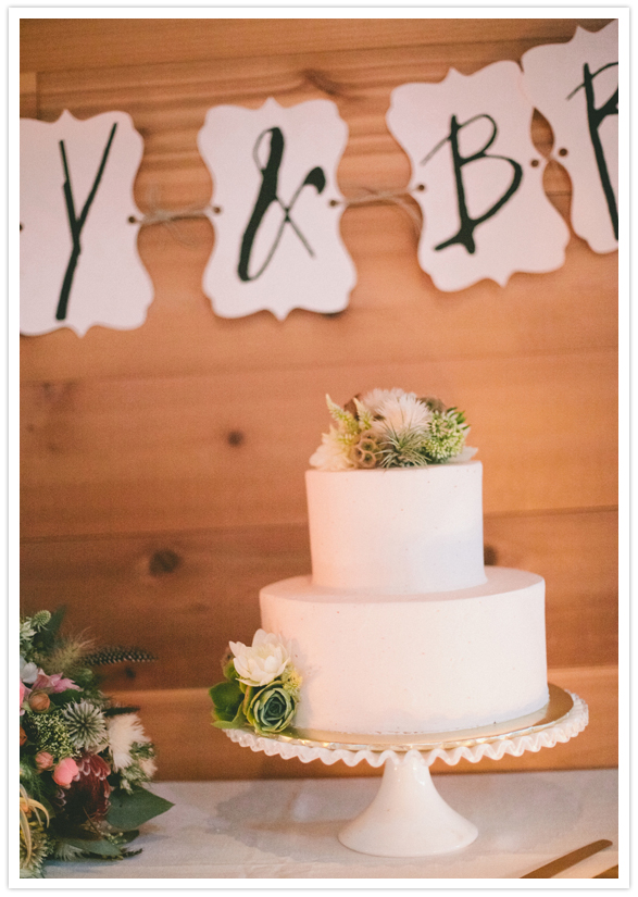 simple white cake and floral accent