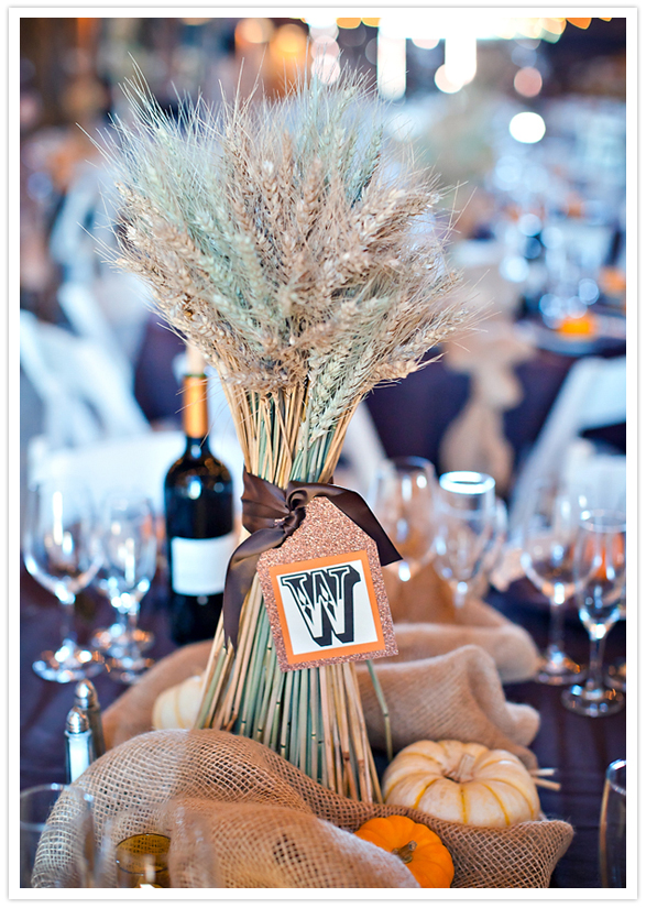 gathered wheat centerpieces with paper monogram tags