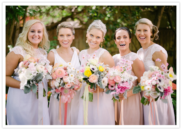 bridesmaids in hues of pink and peach