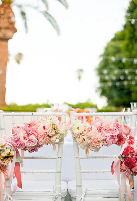 floral garlands for the bride and groom chairs