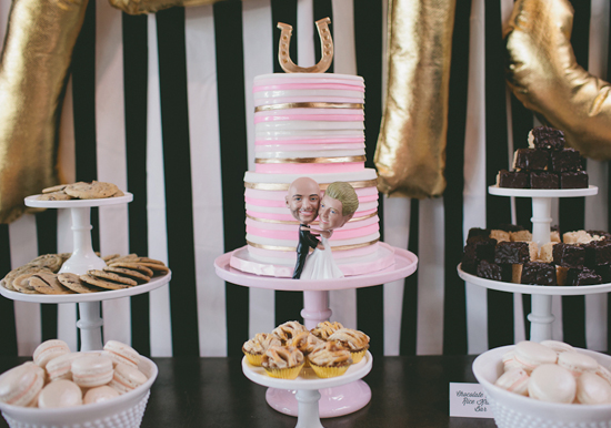 pink, gold and white striped cake and horseshoe cake topper