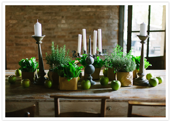 green table decor and white tapered candles