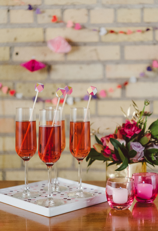 pink champagne with geometric stirrers 