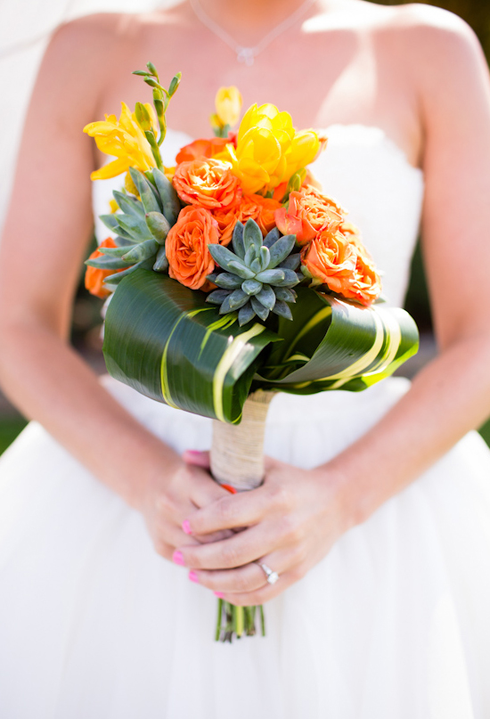 orange and yellow flowers mixed with succulents bouquet