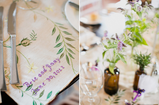 rustic bottle vases and embroidered table linens