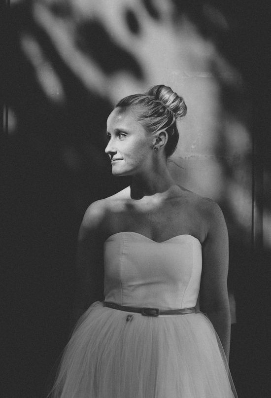 high chignon and belted wedding dress