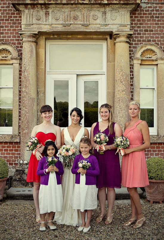 shades of pink, purple and red bridesmaid dresses | Photo by Marianne Taylor