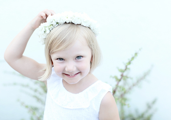 white flower girl dress and floral crown  | Photo by Kimberly Genevieve