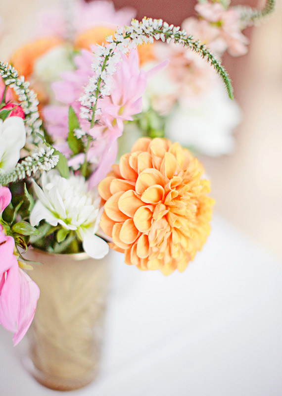 Orange and pink floral centerpiece | photos by Meg Perotti | Planning Sitting in a Tree |100 Layer Cake