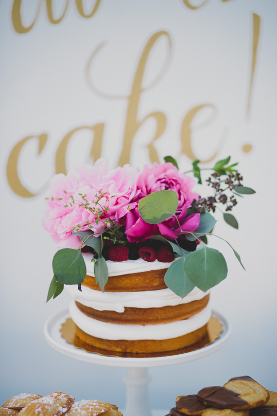 Naked cake with floral topper | Photo by Katie Pritchard Photo | Read more - http://www.100layercake.com/blog/?p=76900