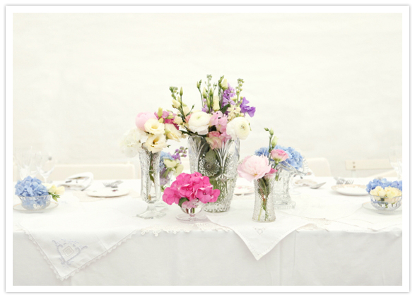 crisp white linens and pastel floral centerpieces