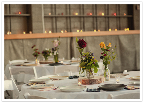 clean white tables with rose bud vases