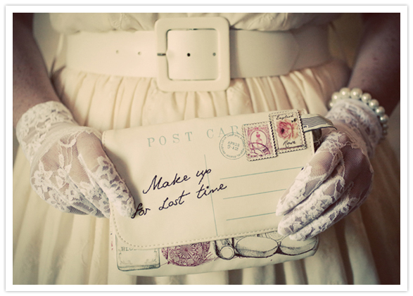 postcard-style clutch and lace gloves