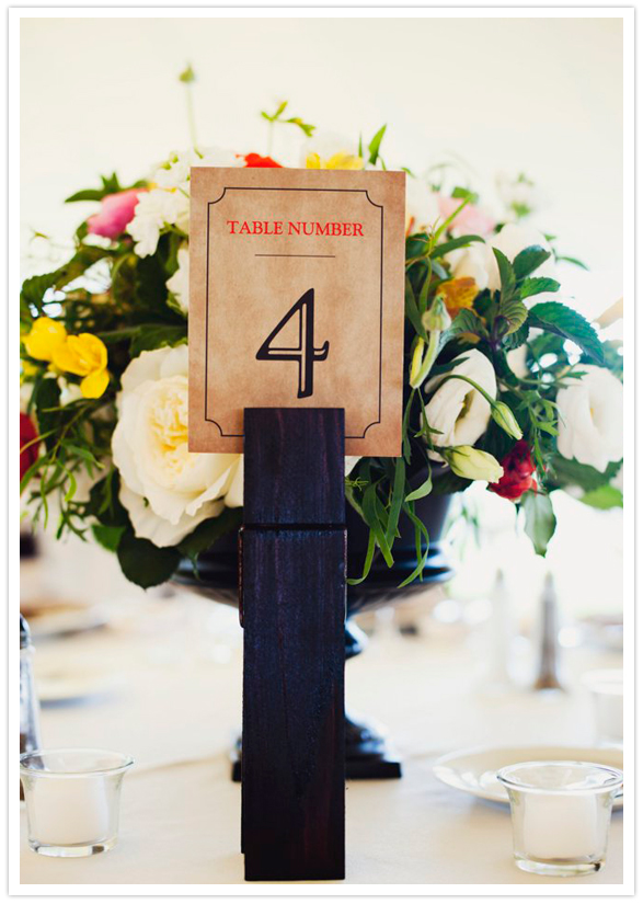 rustic paper table numbers and giant clothespin holder