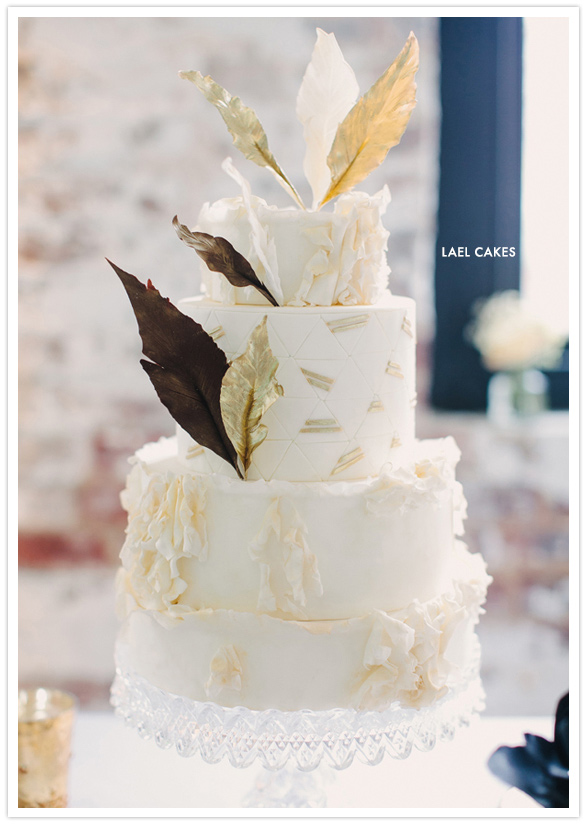 Ivory and gold feature accented wedding cake