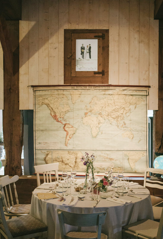 large wall map and delicate table settings