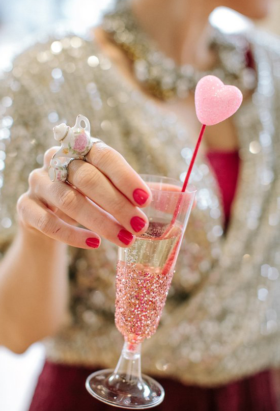 glitter champagne flute and pink heart stirrer