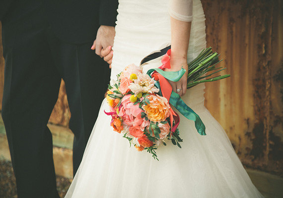 Coral Peonies, Garden Rose, Ranunculus and Billy Buttons bouquet | photos by Jason Hales | 100 Layer Cake