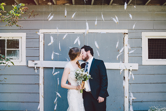 feather ceremony backdrop | photos by Luke Liable Photography | 100 Layer Cake