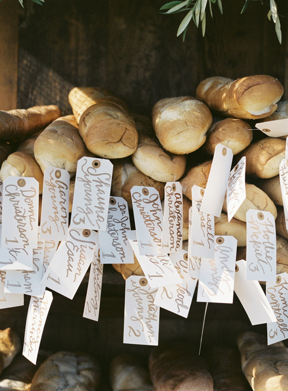 French bread escort cards  | Southern California wedding | Photo by Braedon Flynn | Read more - https://www.100layercake.com/blog/?p=67357 