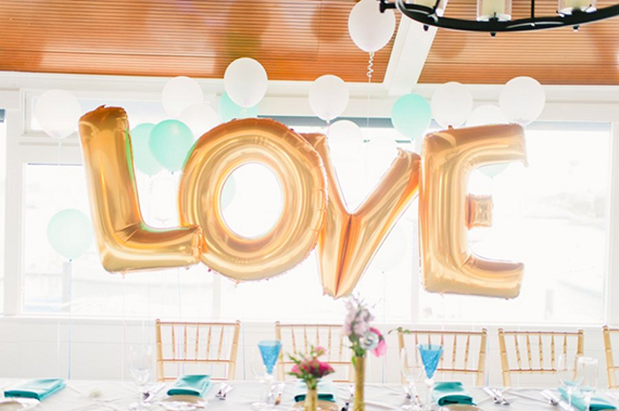 Love letter balloons | photo by Ariane Moshayedi Photography | Read more - https://www.100layercake.com/blog/?p=67732